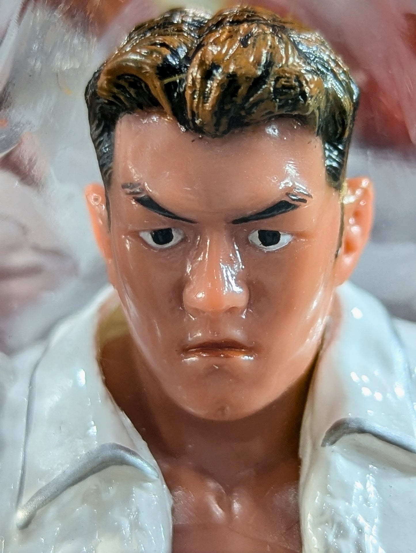 Jun Akiyama (white gown, index finger)