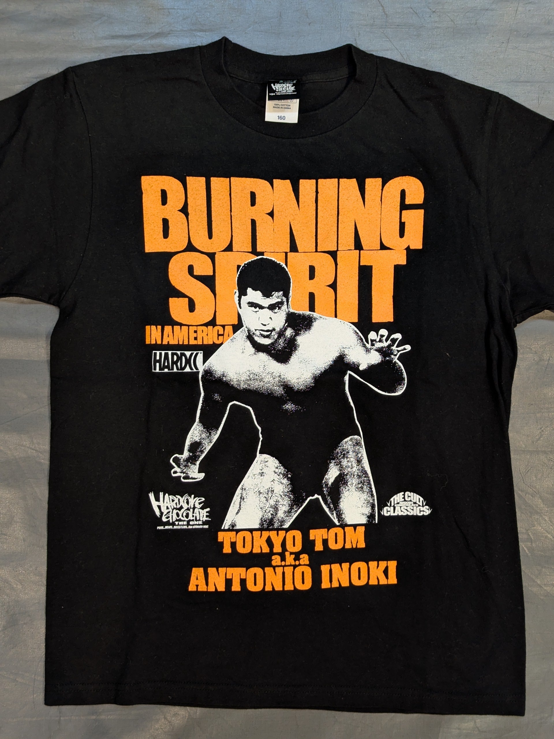 アントニオ猪木「BURNING SPIRIT IN AMERICA(若獅子オレンジ)」Tシャツ