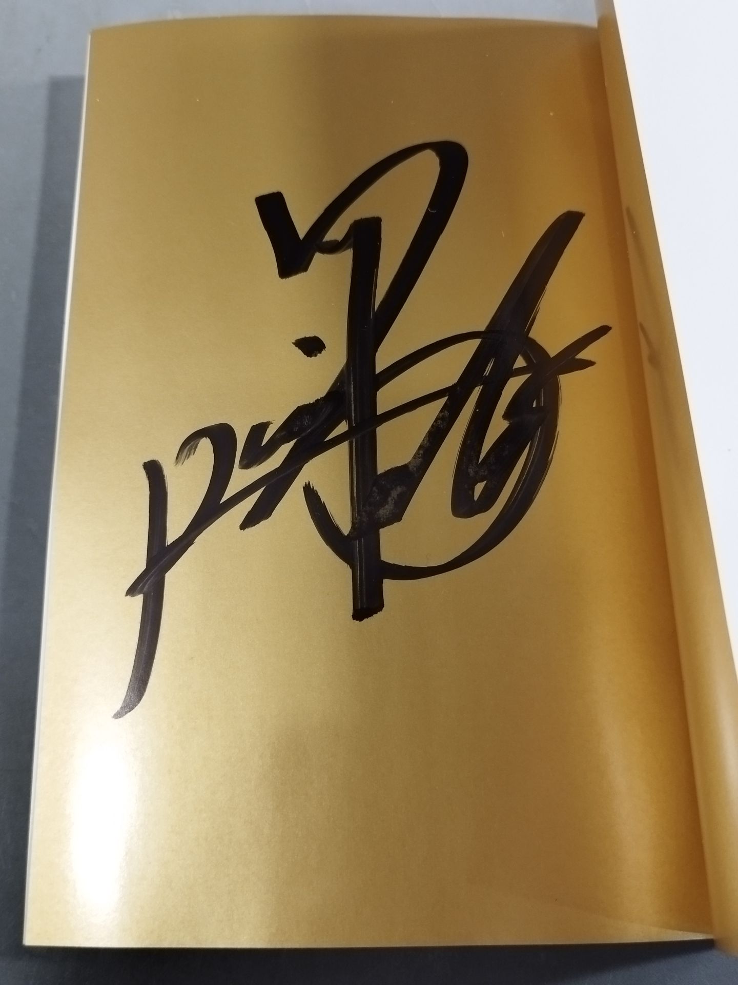 Kazuchika Okada  hand signed autograph : The Golden Rule of Raining Gold on Your Life