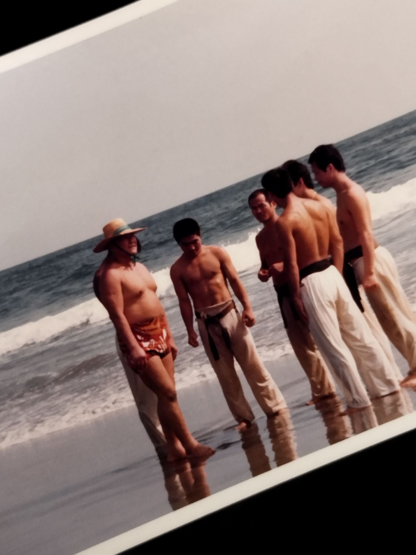 Mas Oyama (Masutatsu Oyama)  with his disciples on the beach photo