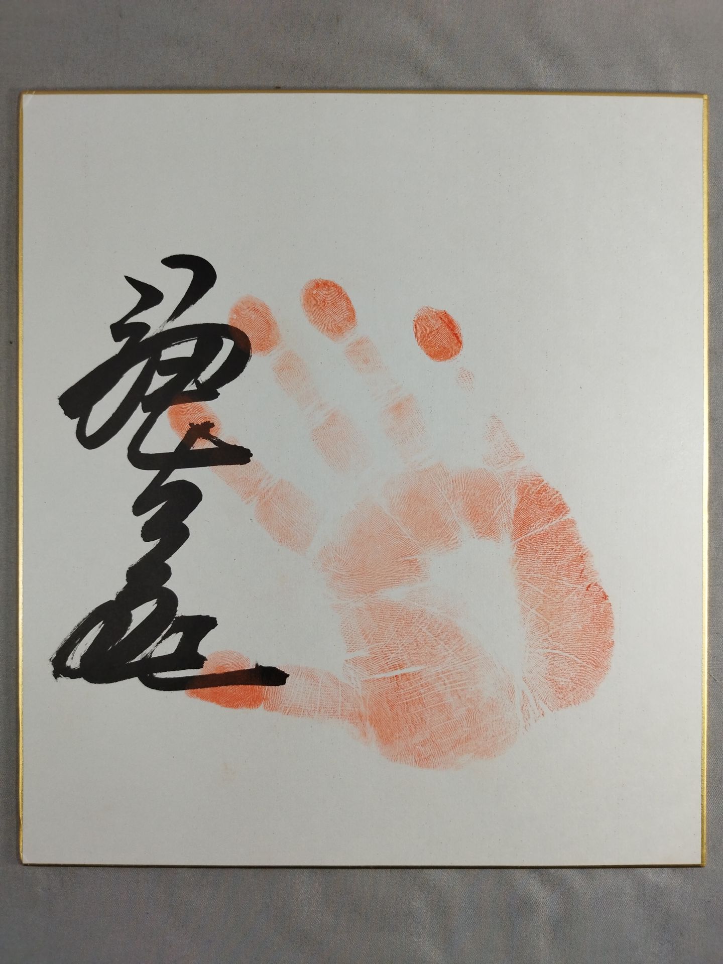 With handprint