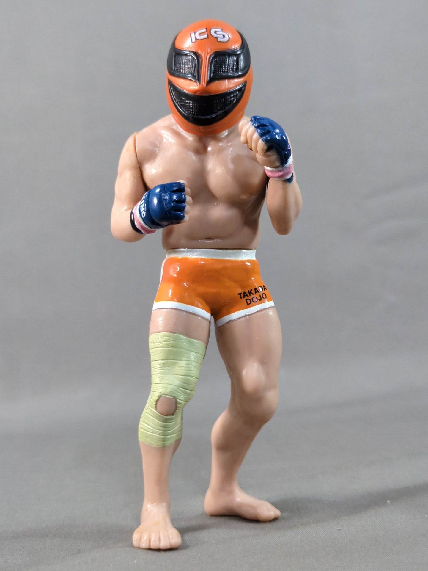 Kazushi Sakuraba (with red hair and SAKU machine)