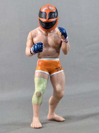 Kazushi Sakuraba (with red hair and SAKU machine)