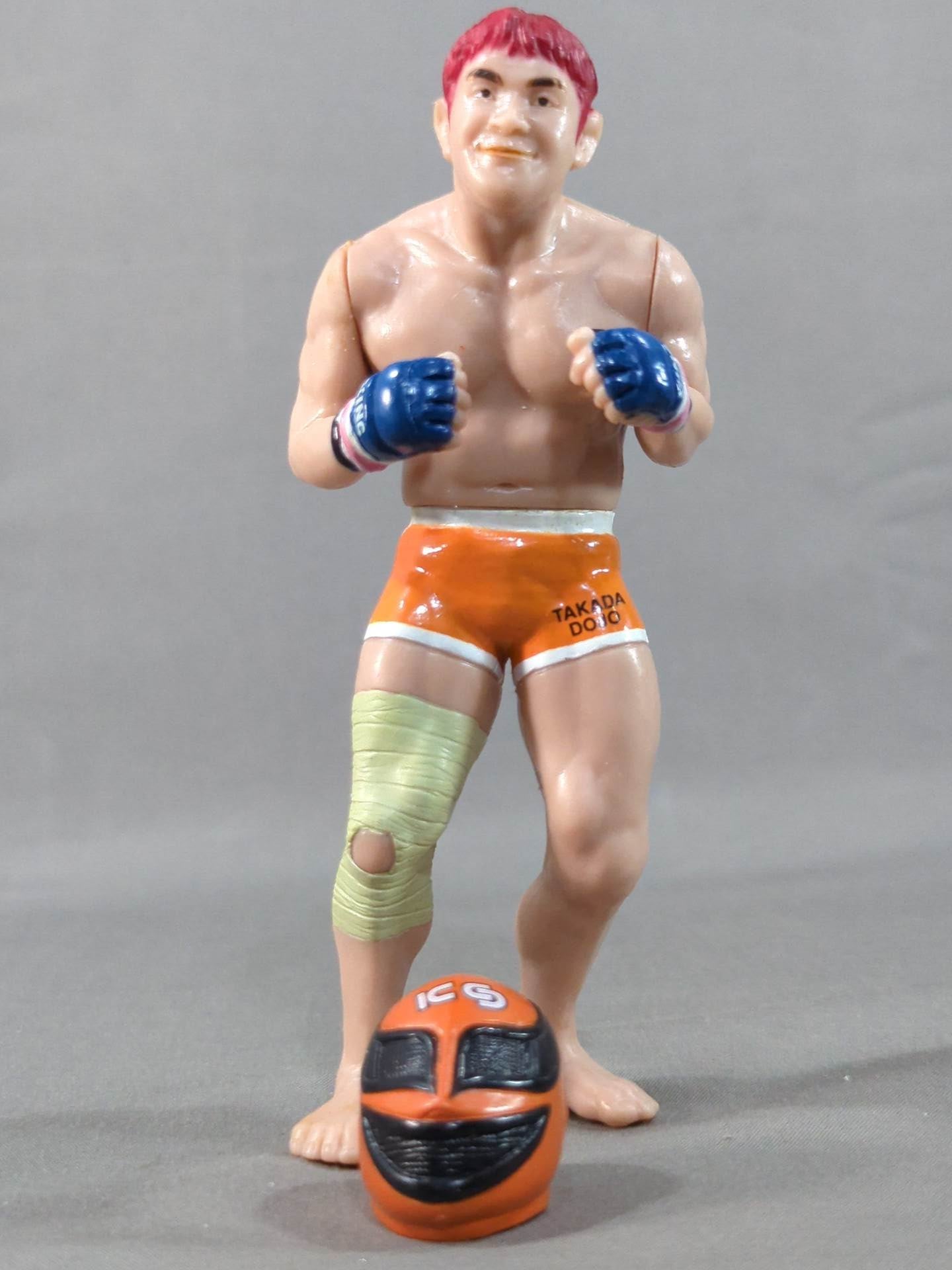 Kazushi Sakuraba (with red hair and SAKU machine)