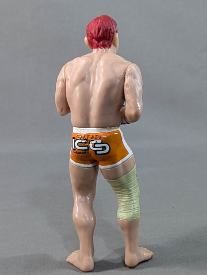 Kazushi Sakuraba (with red hair and SAKU machine)