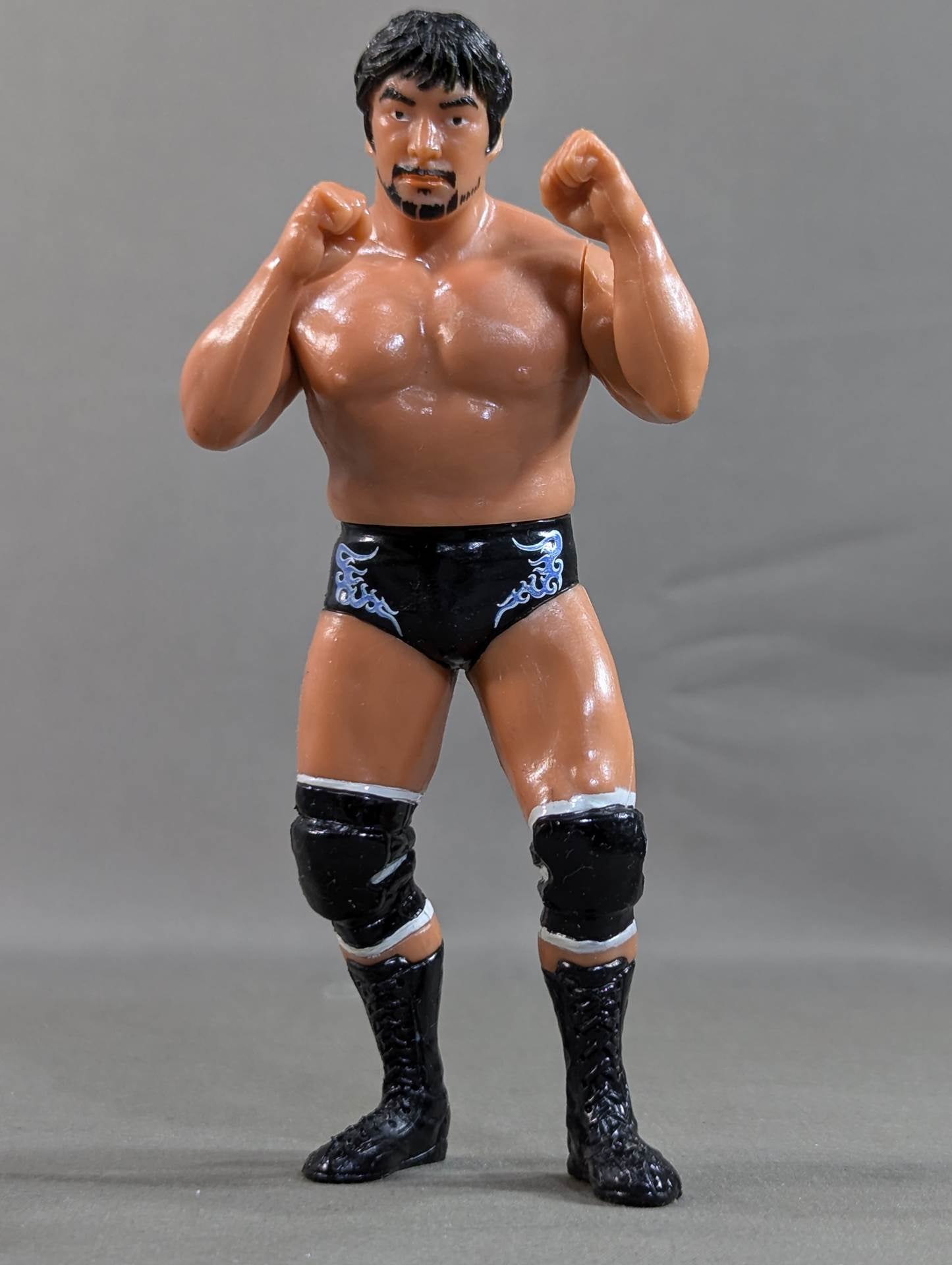 Kenta Kobashi  (Black Pants, Beard, Fighting Pose)