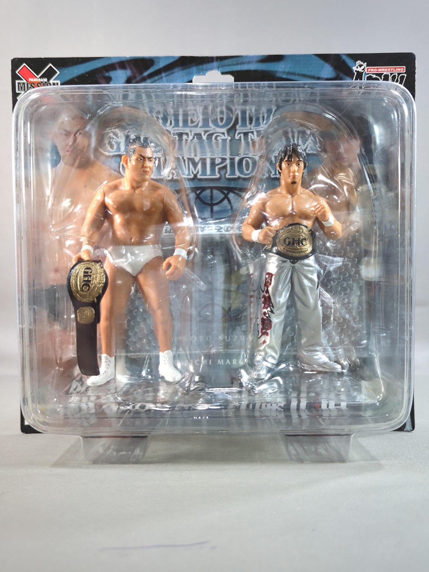 Minoru Suzuki (white) & Naomichi Marufuji  (silver)