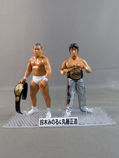 Minoru Suzuki (white) & Naomichi Marufuji  (silver)