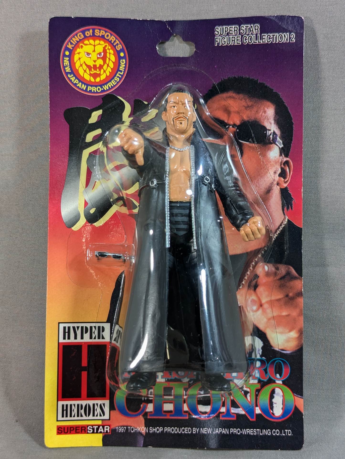 Masahiro Chono  (black gown + sunglasses)