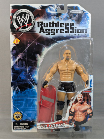 Goldberg (chair, black pants)