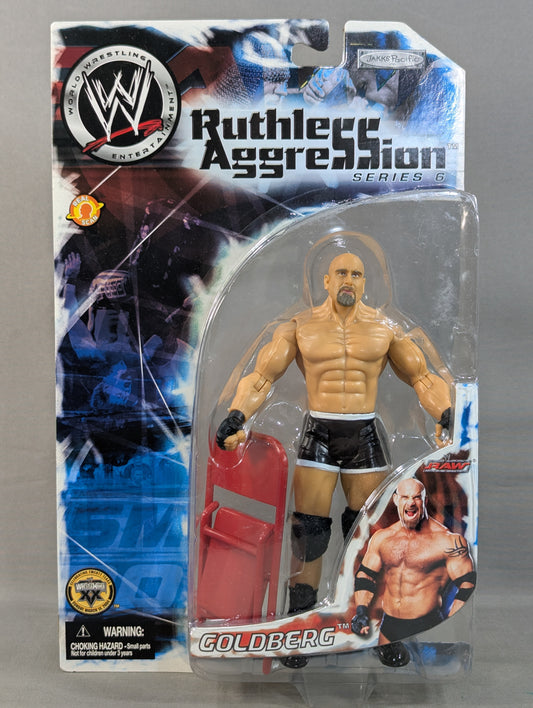 Goldberg (chair, black pants)