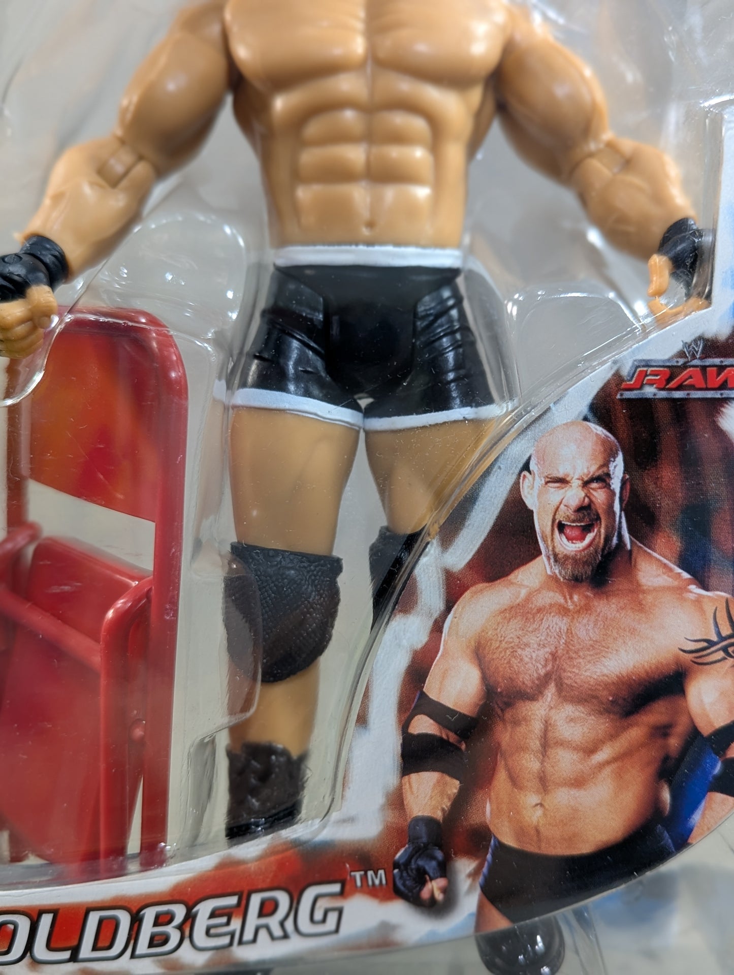 Goldberg (chair, black pants)