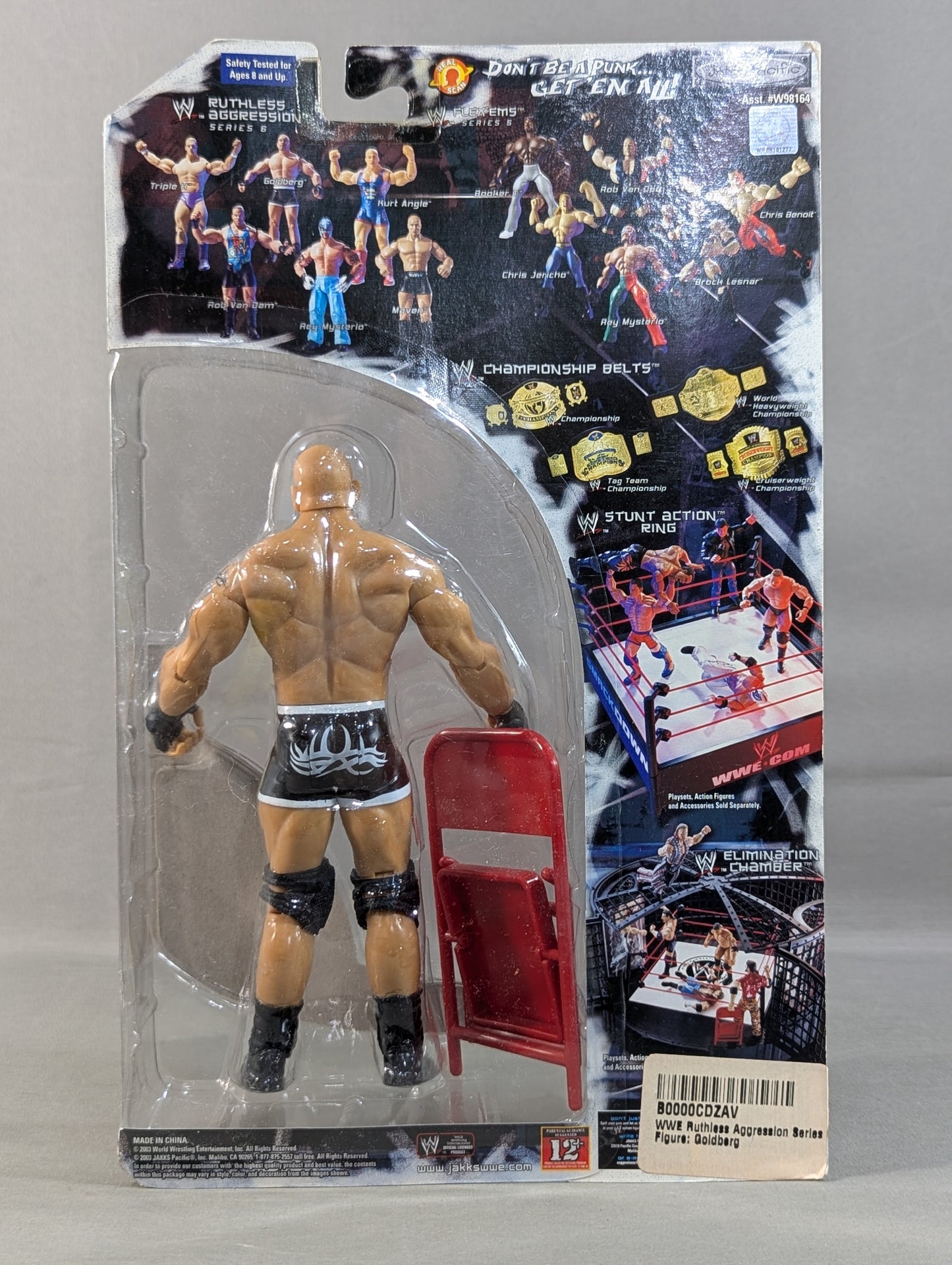 Goldberg (chair, black pants)