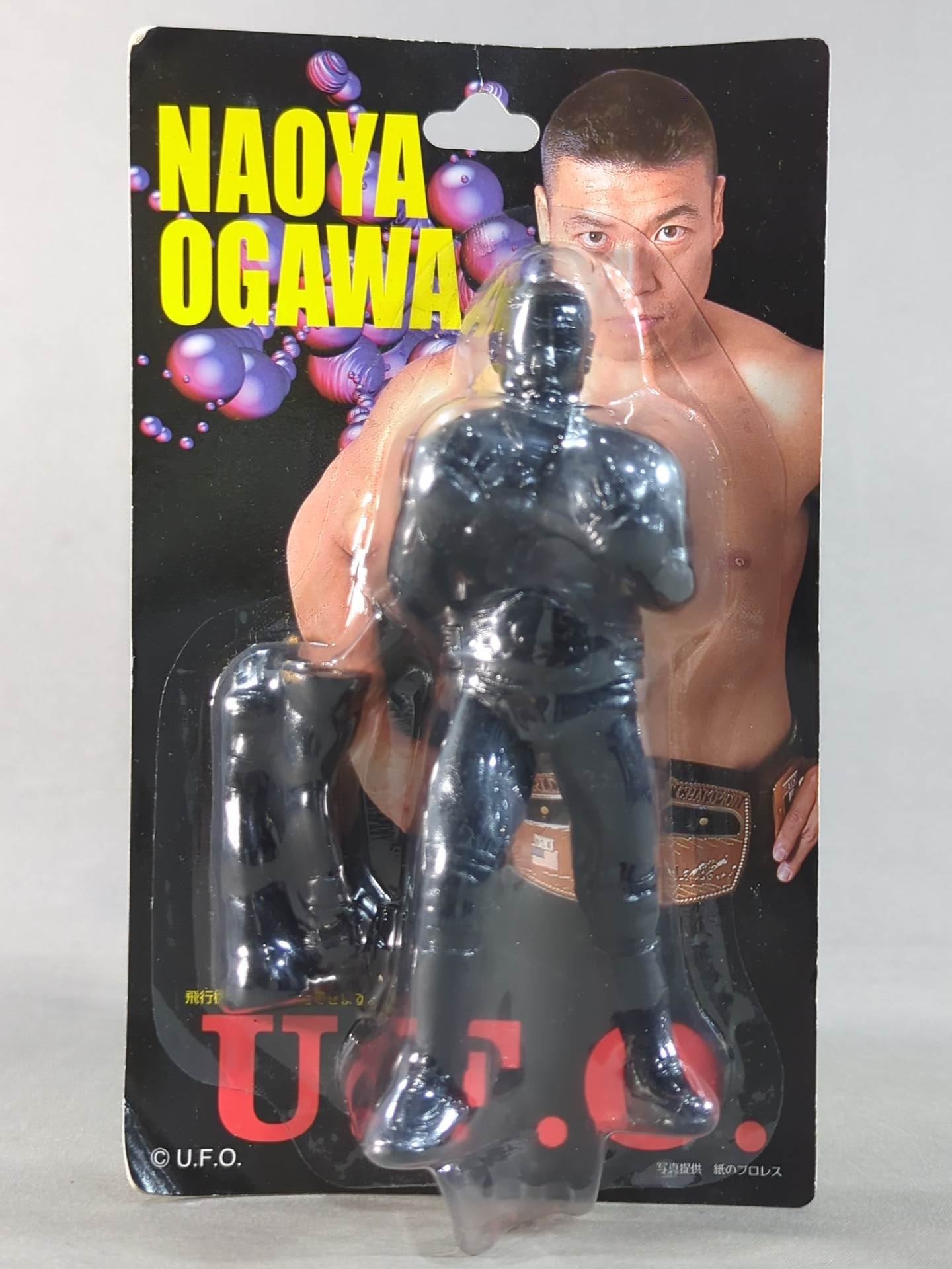 Naoya Ogawa (NWA belt, airplane arm, bronze)