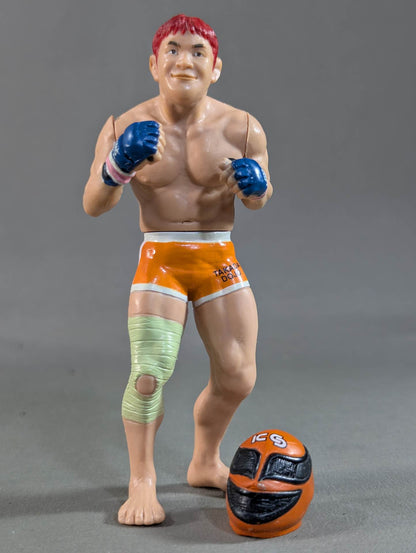 Kazushi Sakuraba (with red hair and SAKU machine)