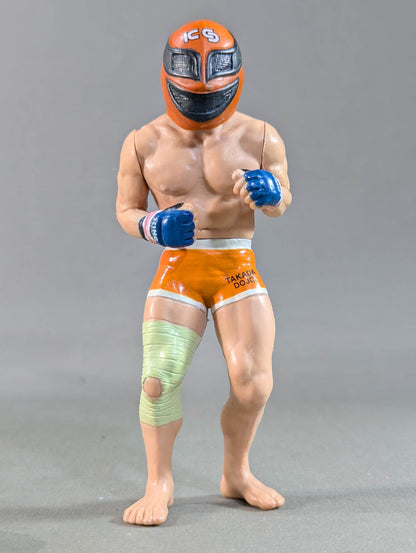 Kazushi Sakuraba (with red hair and SAKU machine)