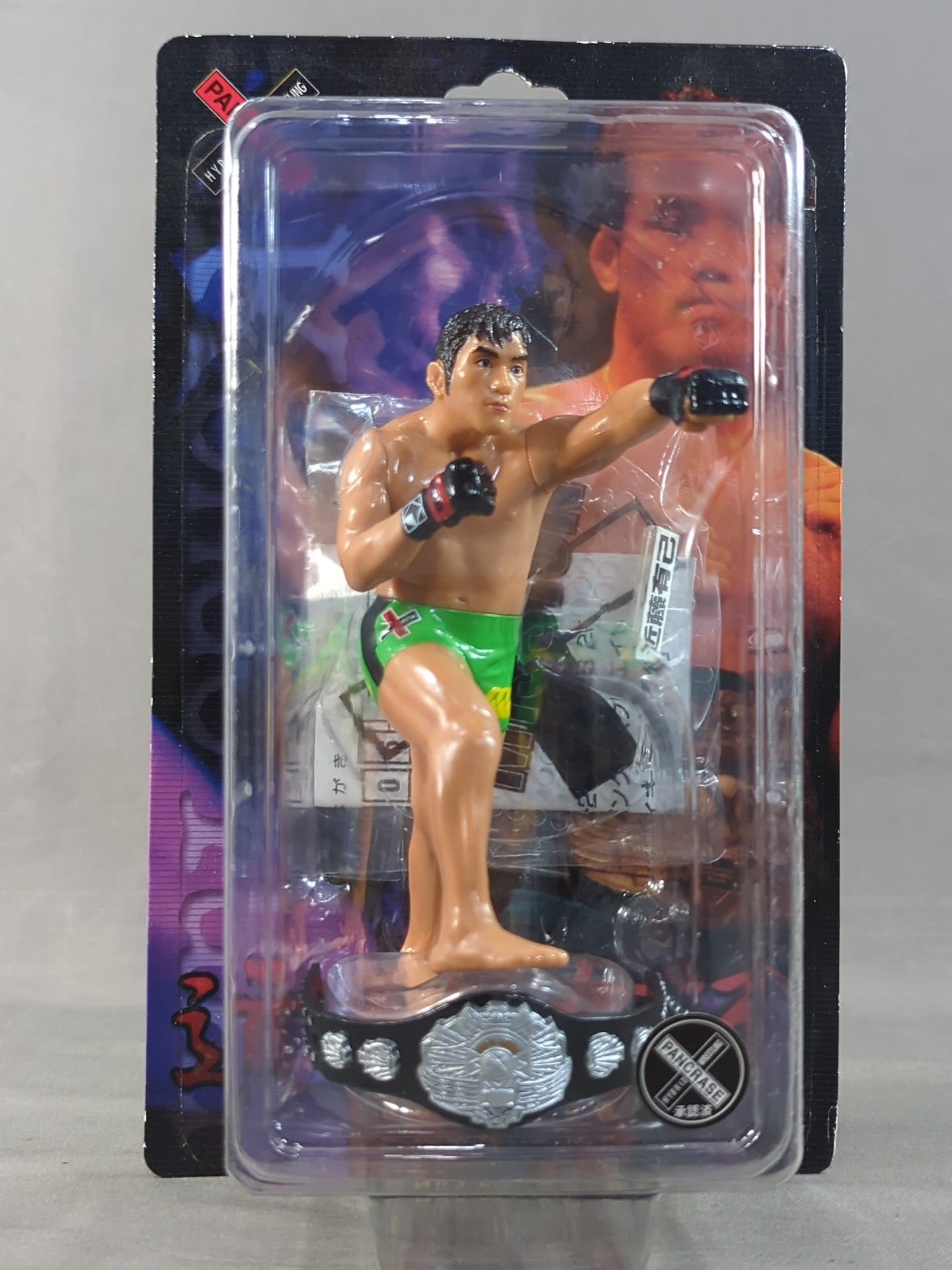 Yuki Kondo (with belt, yellow-green pants, left hook)