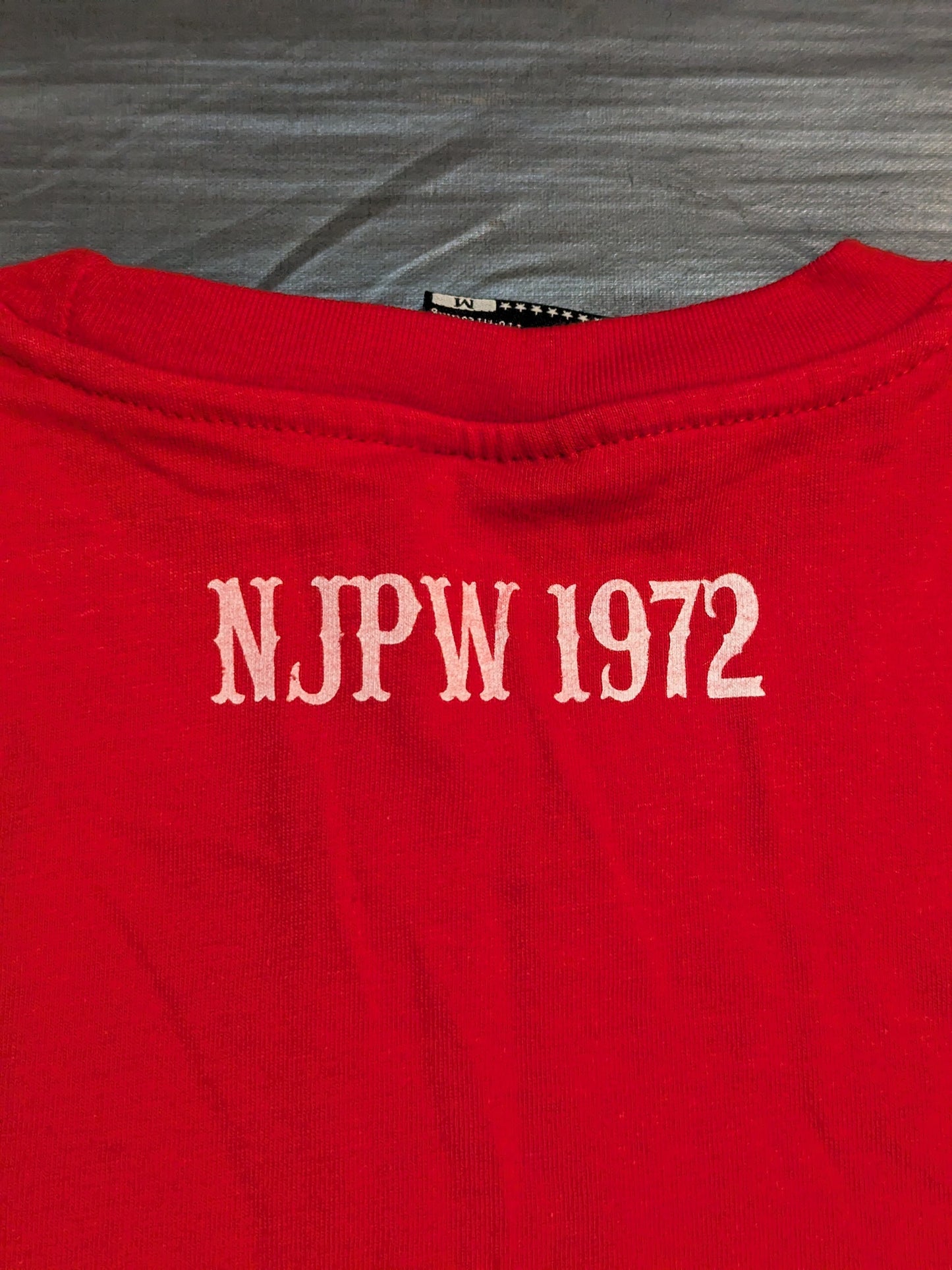 New Japan Pro Wrestling × Shimamura Lion Mark Long sleeve T-shirt (red × camouflage)