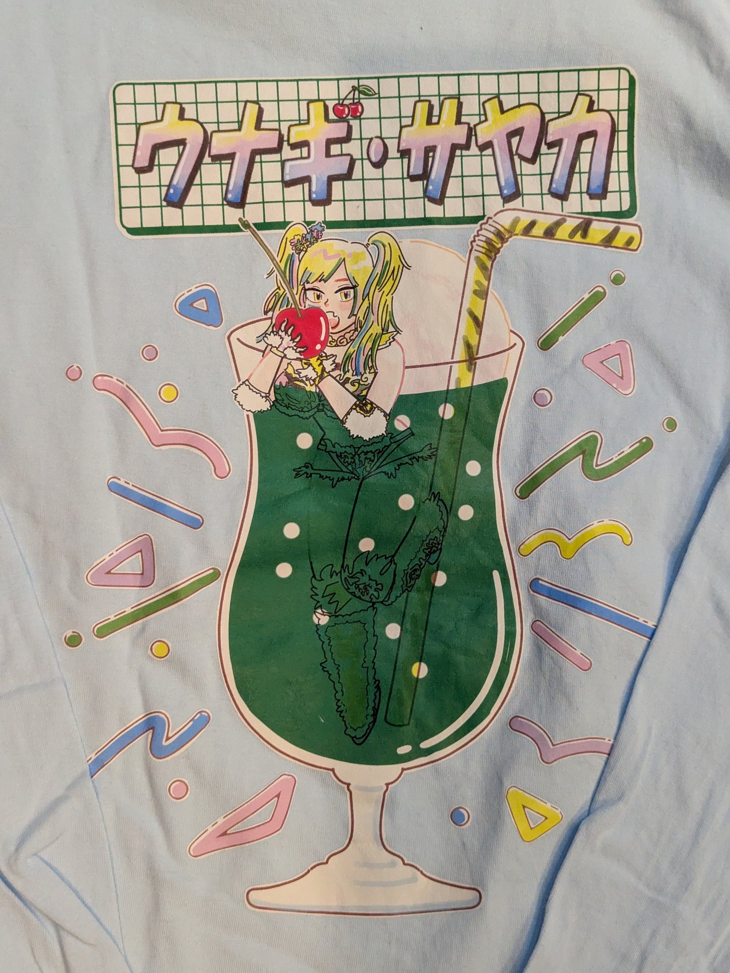 ウナギ・サヤカ「極彩メロンソーダブリーフ味」ロングスリーブTシャツ(ライトブルー)