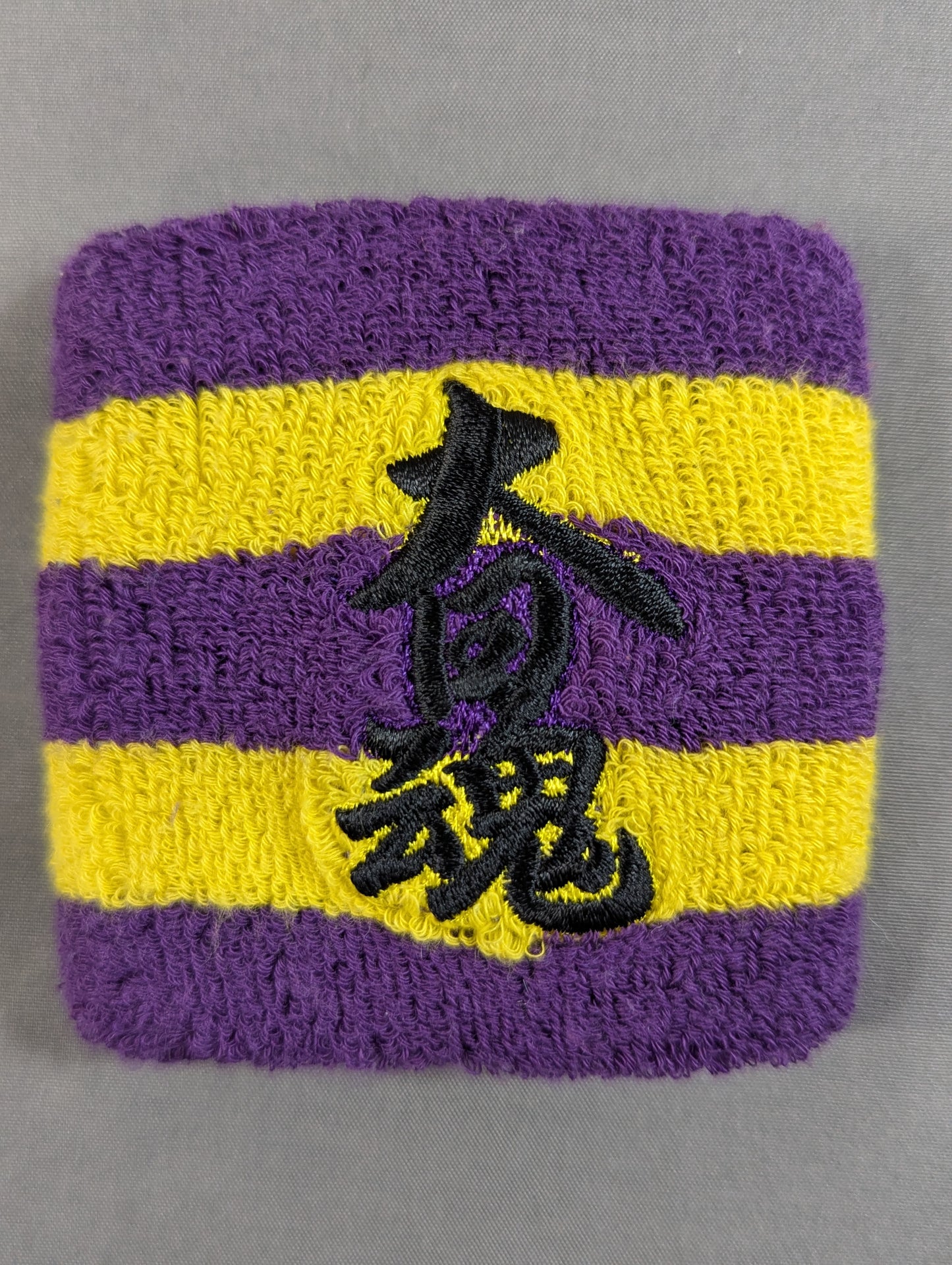 大日本プロレス「大日魂」リストバンド(紫×黄)