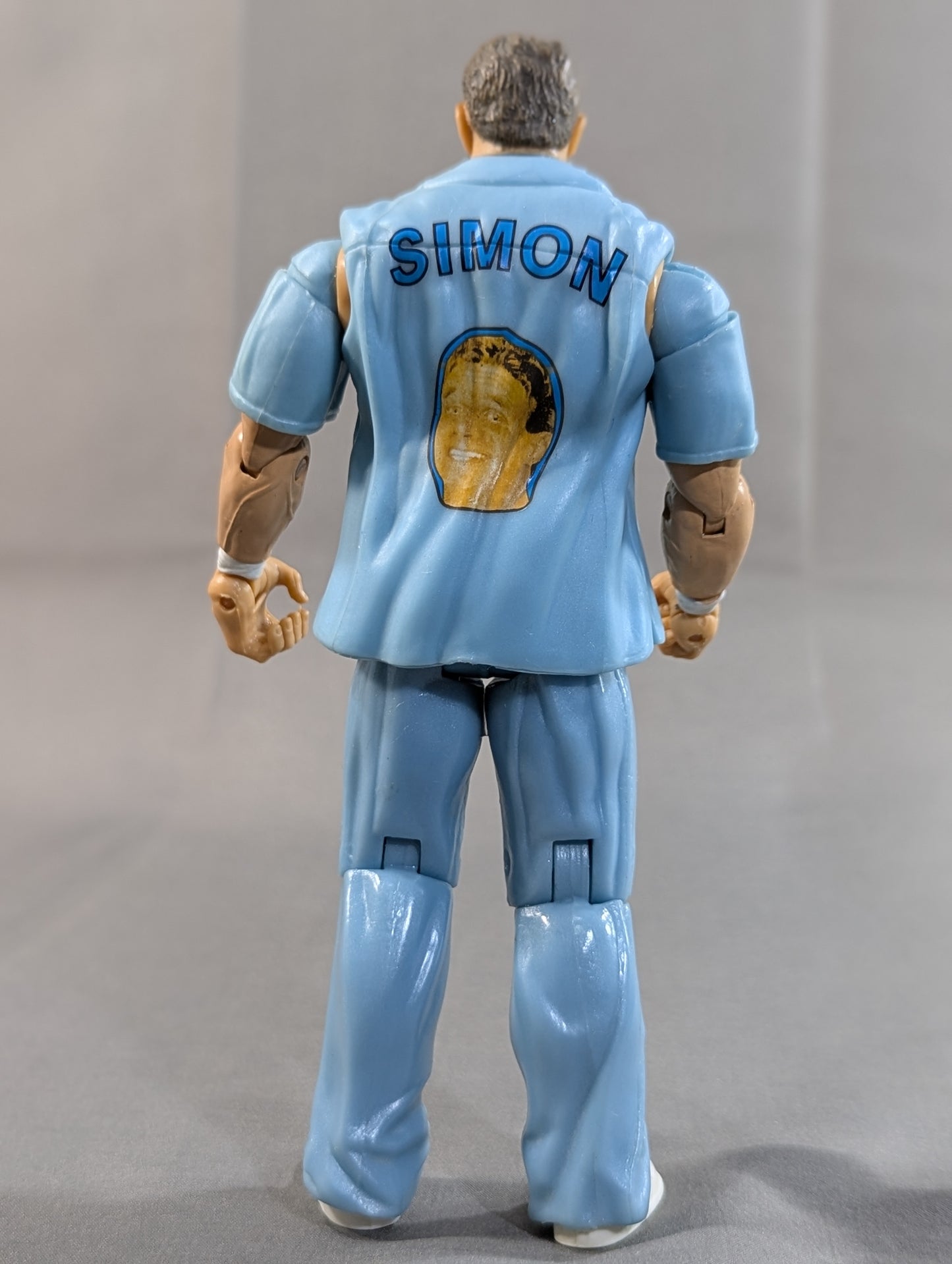Simon Dean (light blue shirt)