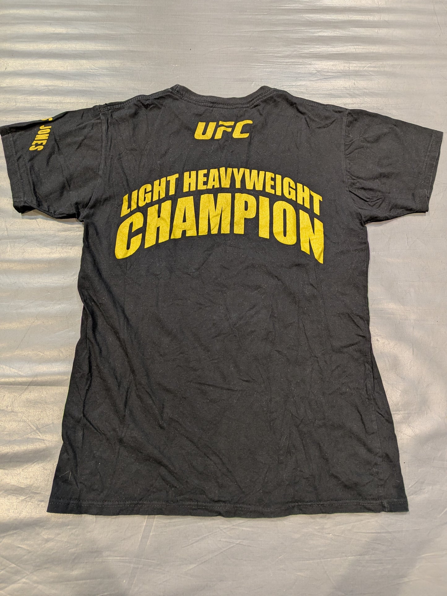 ジョン・ジョーンズ「LIGHT HEAVYWEIGHT CHAMPION」Tシャツ