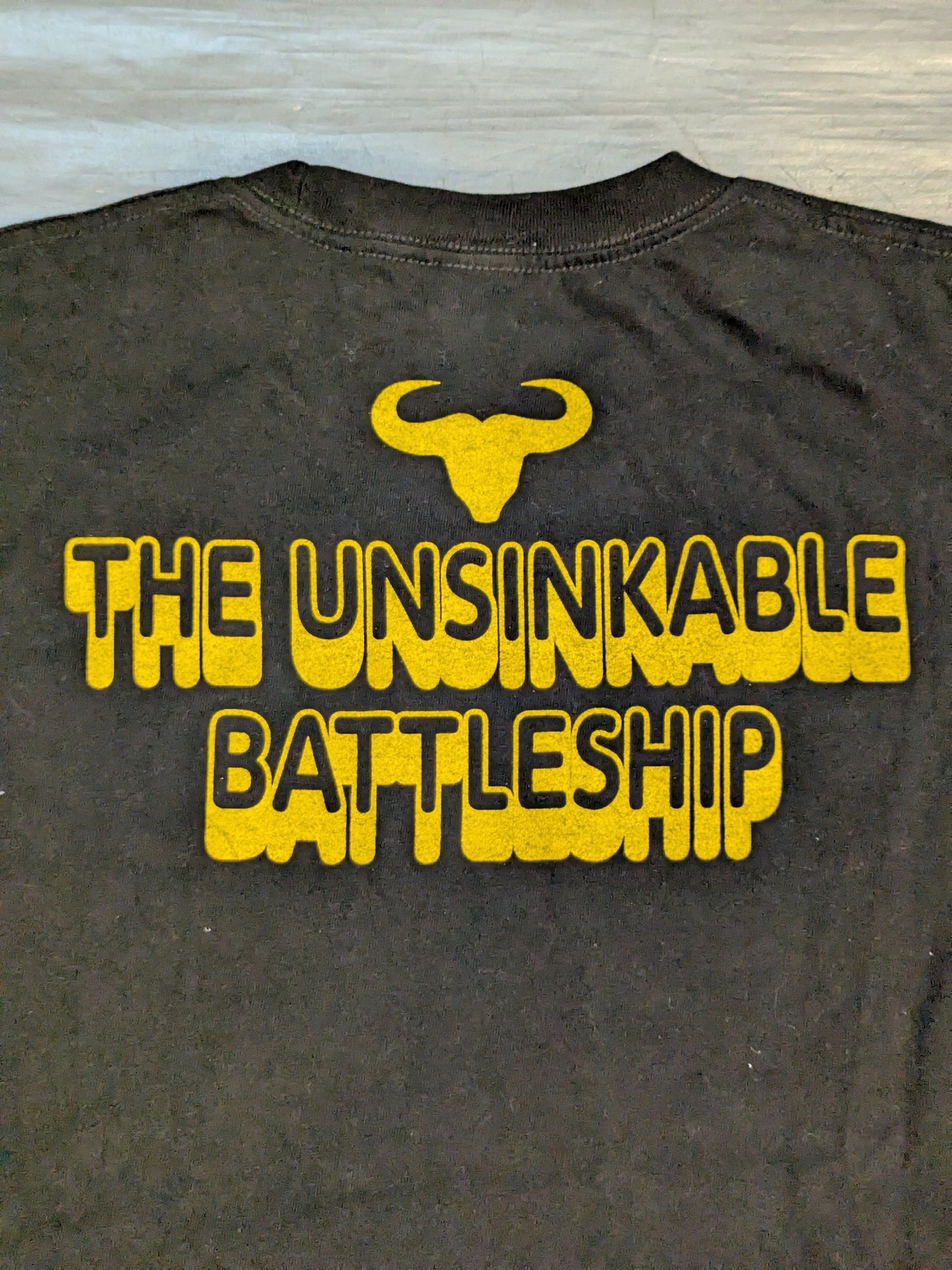 Stan Hansen "THE UNSINKABLE BATTLESHIP" Illustration T-Shirt (Black)