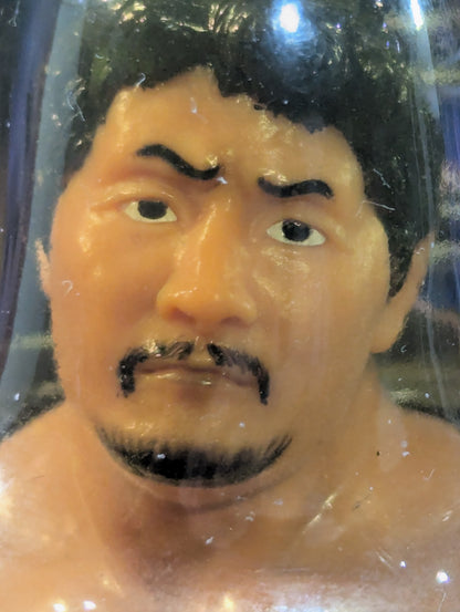 Akira Maeda  (red wristband, beard)
