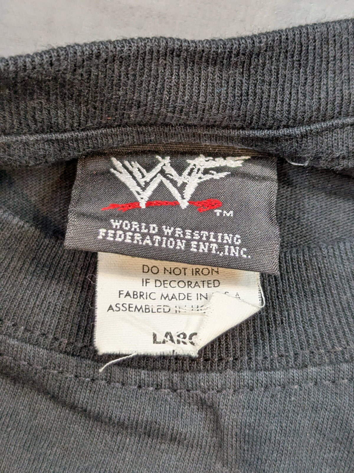 ストーン・コールド・スティーブ・オースチン「WHAT A HELL YOU LOOKING AT JACK ASS!!」Tシャツ(WWF(2000) / ブラック)